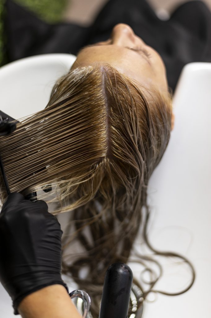 Services woman getting her hair washed beauty salon
