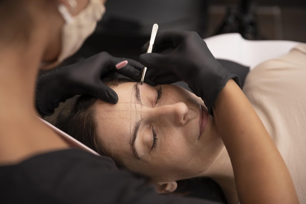 Services woman going through microblading treatment